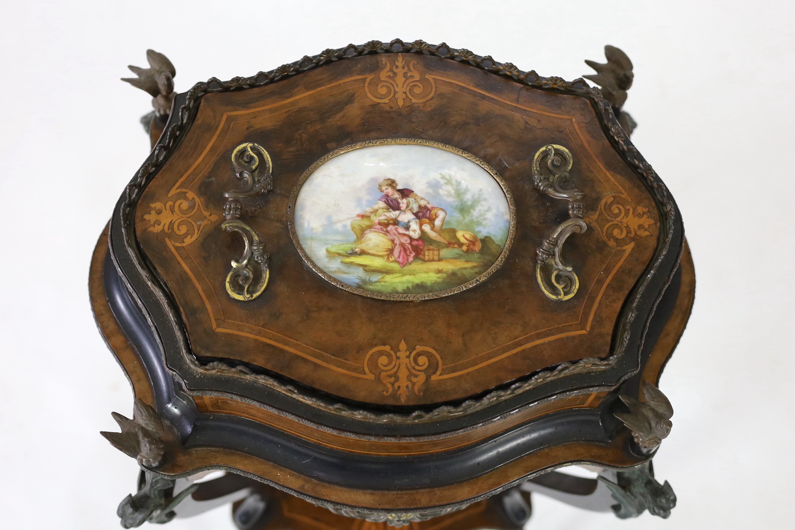 A 19th century French walnut and marquetry porcelain mounted two tier table, width 48cm, depth 35cm, height 88cm